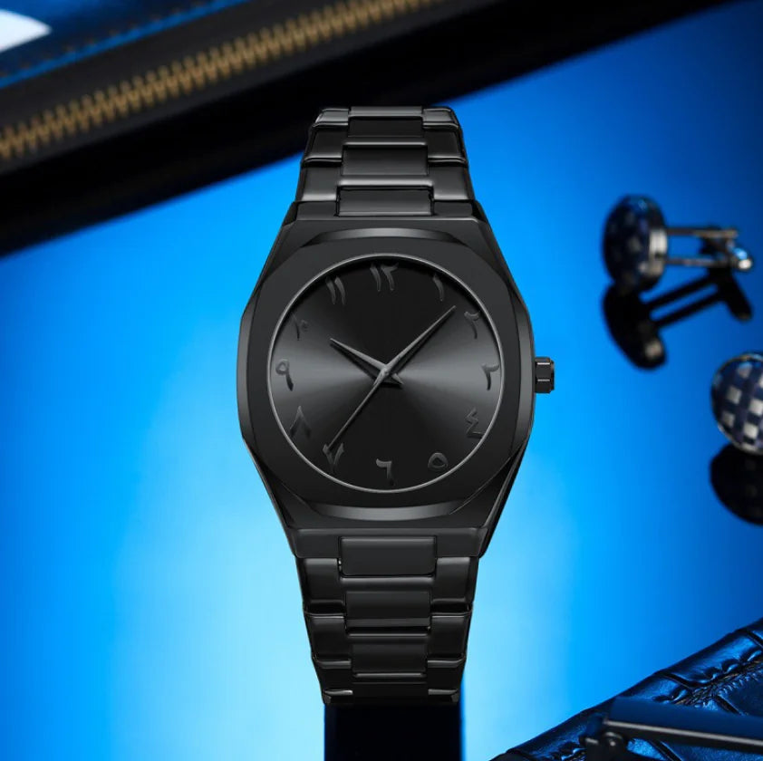 Black wristwatch on a blue background with a blurred product in the foreground