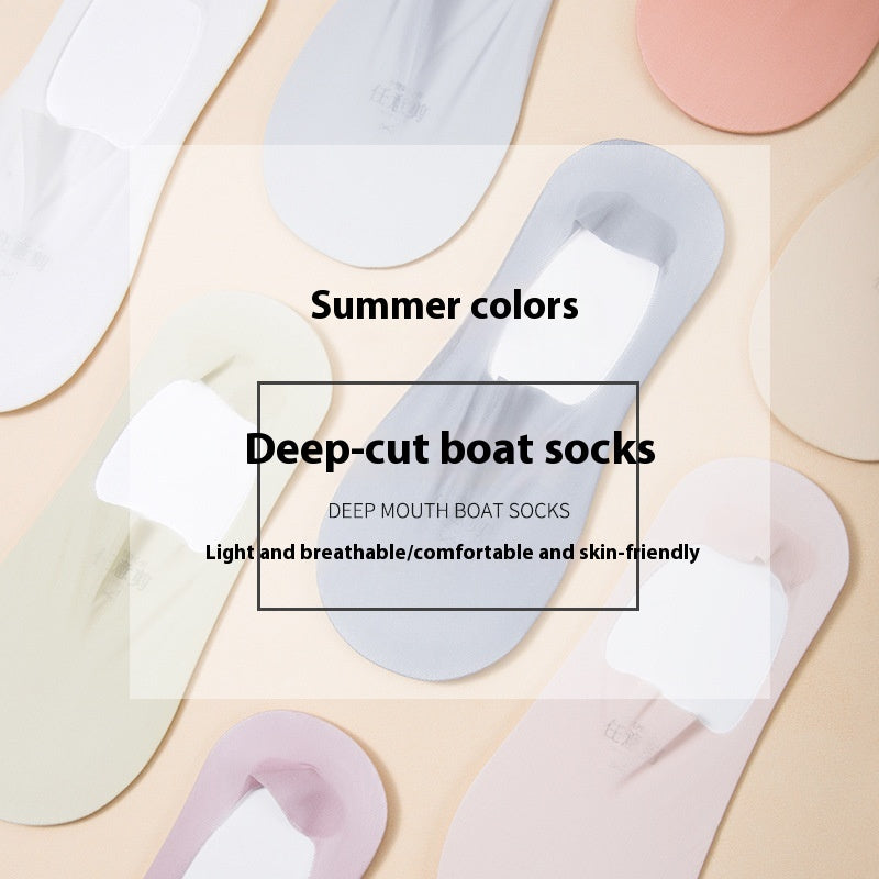 Collection of deep-cut boat socks in various pastel colors on a light background.