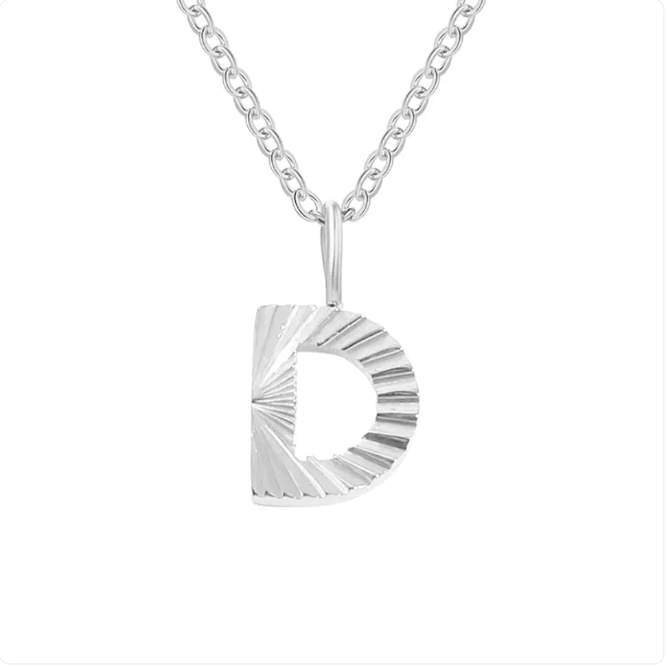 Silver necklace with a circular pendant on a white background