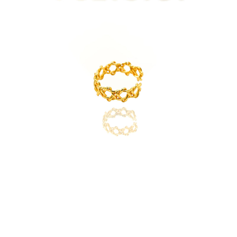 Two gold rings with a chain design on a white background