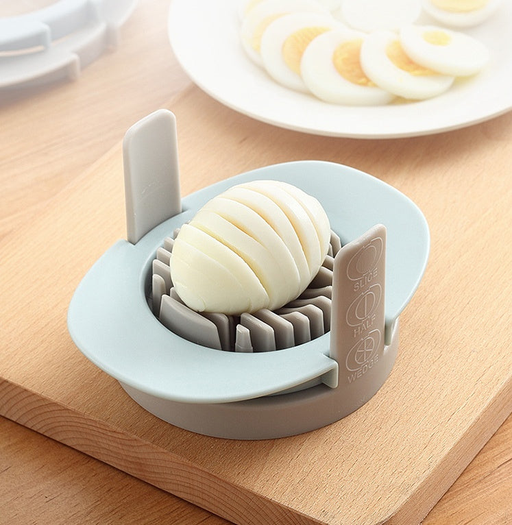 Dessert slicer with a piece of cake on a wooden surface