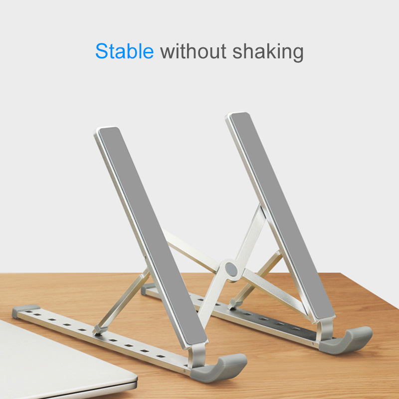 Metallic laptop stand on a wooden surface with text 'Stable without shaking' on a light gray background.