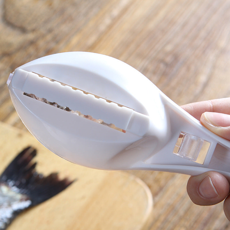 White citrus juicer held by a hand on a wooden surface