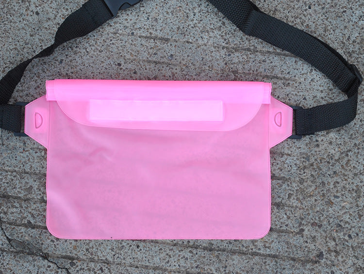 Pink waist bag with a black strap on a concrete surface