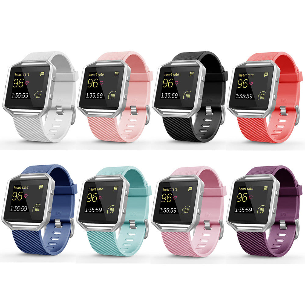 Collection of smartwatches with various colored bands on a white background