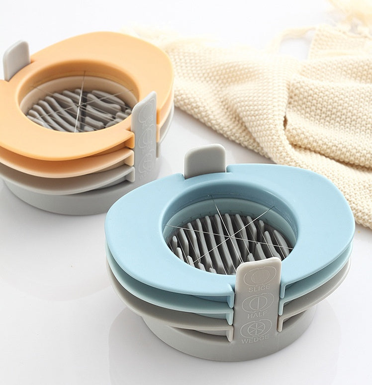Collapsible sink strainer with multiple colors on a white surface