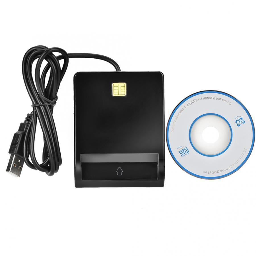 Black USB device with cable and a CD on a white background