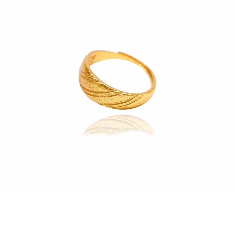 Gold ring with wavy design on a white background