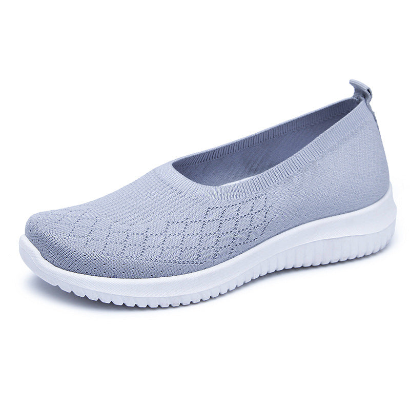 Light blue slip-on shoe with white sole on a white background