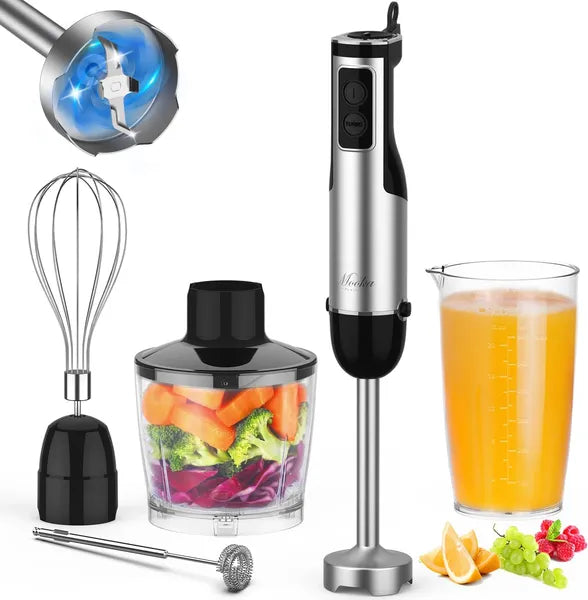 Stainless steel immersion blender with attachments and a glass of orange juice on a white background