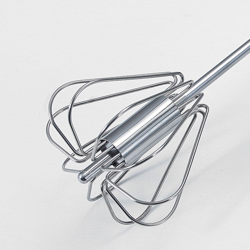 Metal whisk on a white background