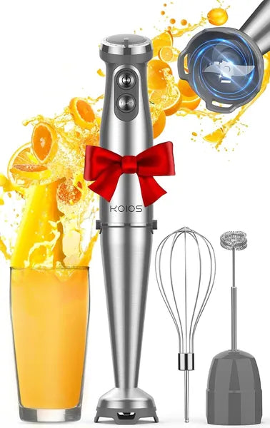 Hand blender with attachments on a white background, surrounded by orange juice and a red bow.