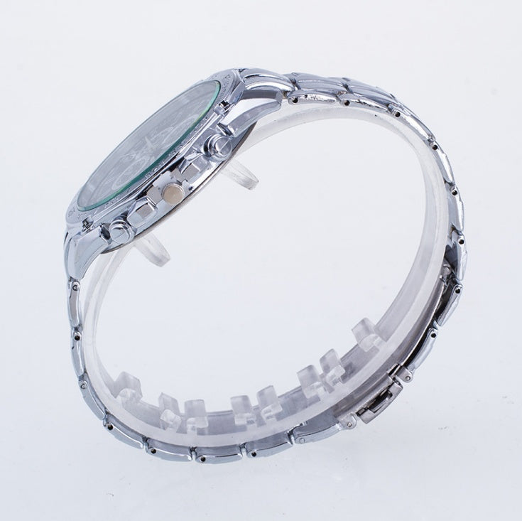 Silver watch with clear face and bezel on a white background