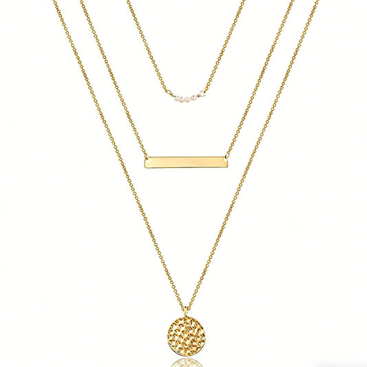 Three gold necklaces with different pendants on a white background