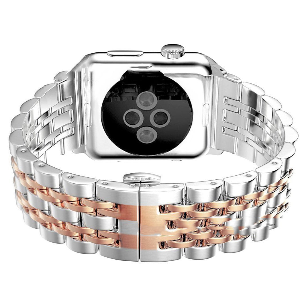 Two-tone silver and rose gold watch band on a white background