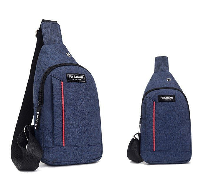 Two blue sling bags with black straps and red accents on a white background