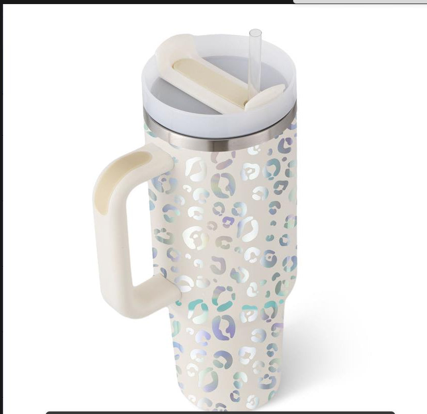 Leopard print mug with handle and straw on a white background