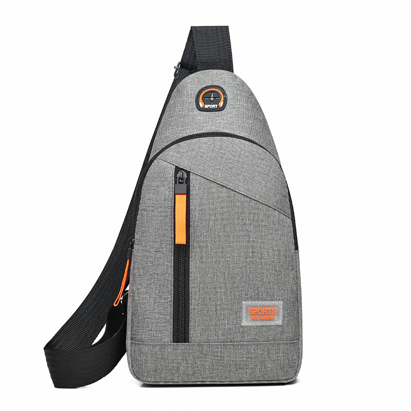 Gray crossbody bag with orange accents on a white background
