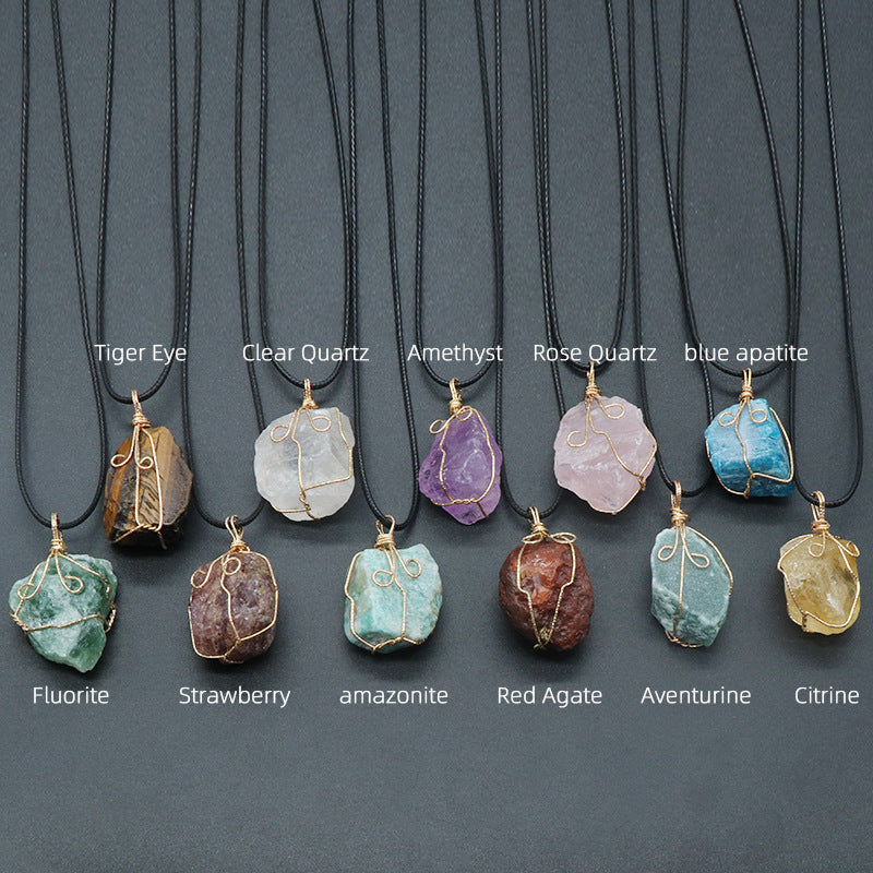 Necklaces with various stone pendants on a gray background