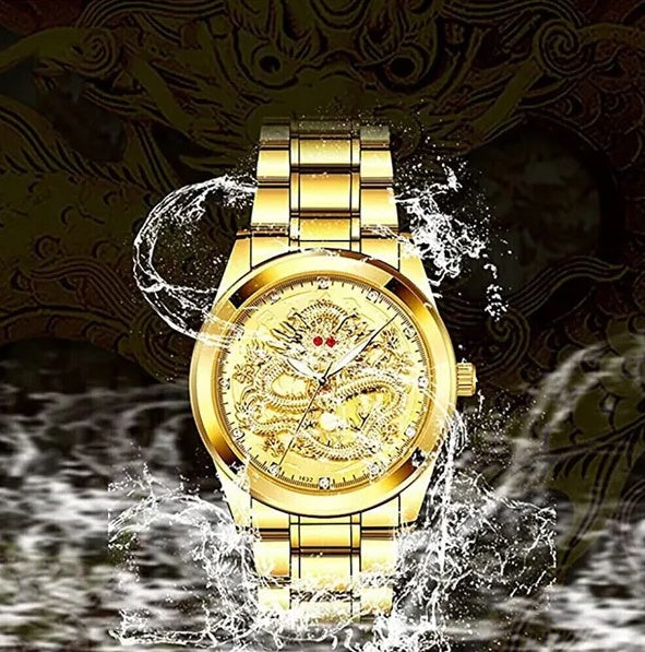 Gold wristwatch with water splash effect on a dark background