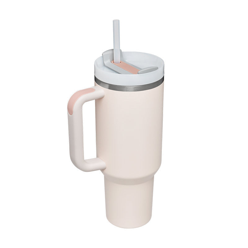 White tumbler with a handle and straw on a white background