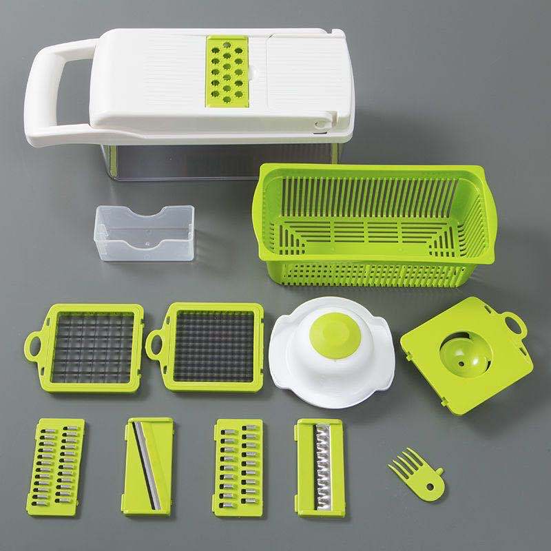 Set of green and white kitchen tools on a gray background