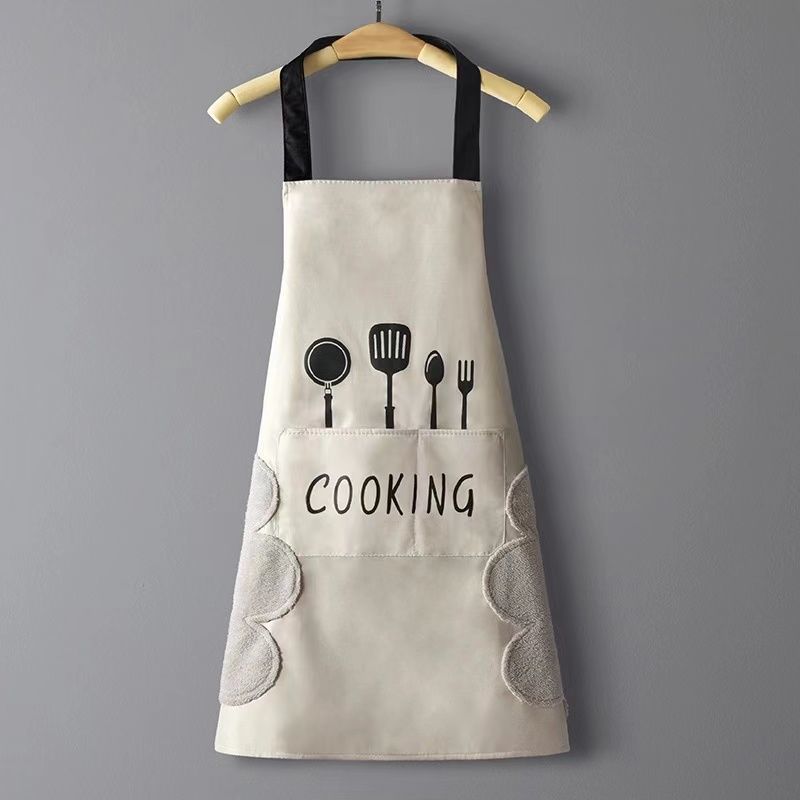 Beige apron with black accents and 'COOKING' text on a gray background