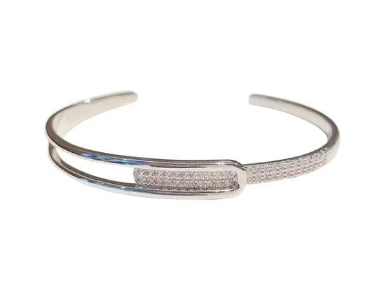 Silver bracelet with a bar design on a white background