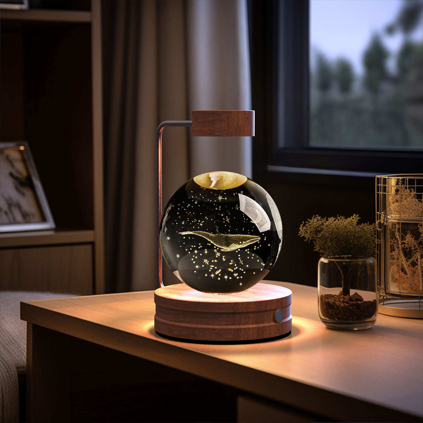 Decorative lamp with fish in a glass sphere on a wooden table.