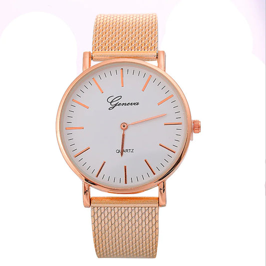 Rose gold watch with white face on a white background