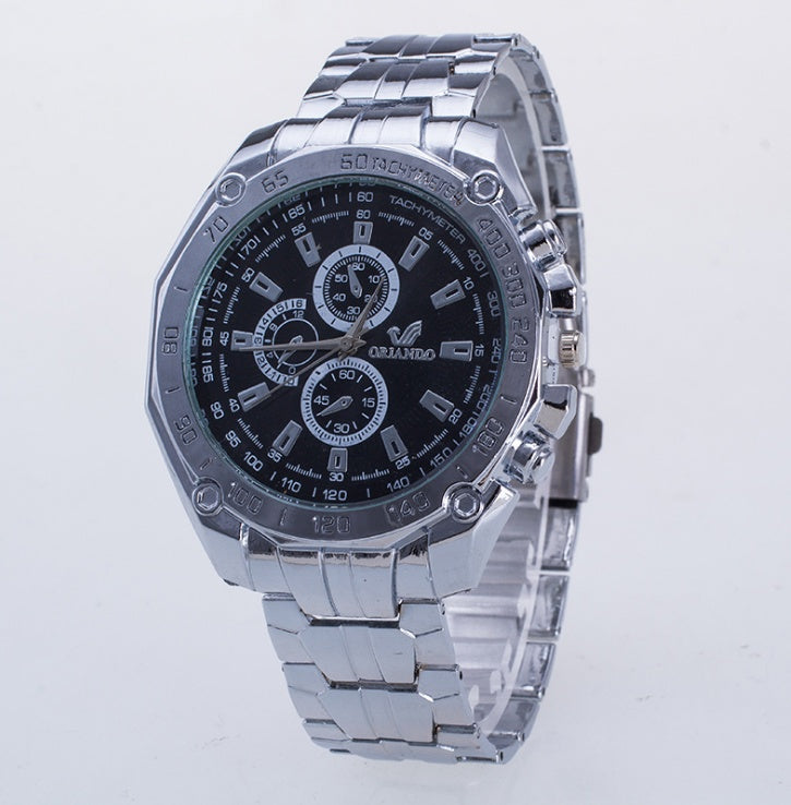 Silver wristwatch with a black dial on a light gray background