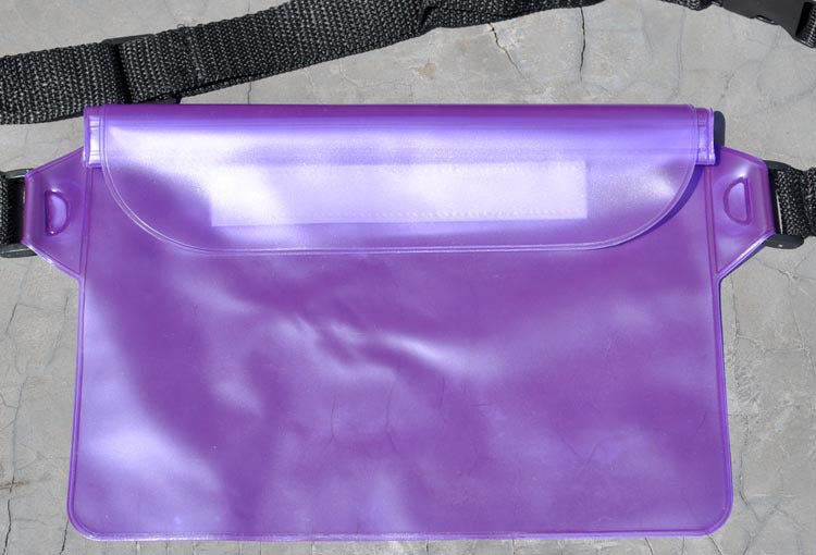 Purple waist bag on a textured surface