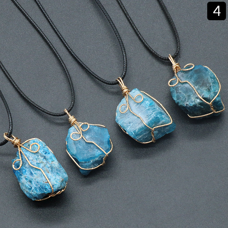 Four blue stone pendants on black cords against a gray background
