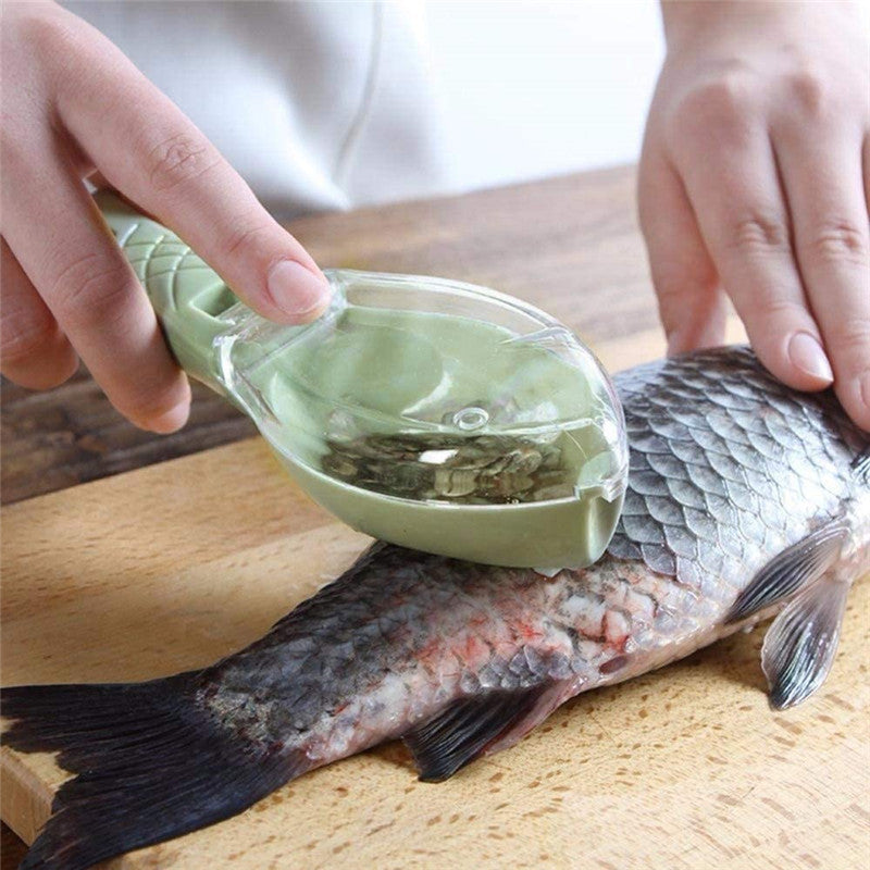 Person seasoning a fish with a green container on a wooden surface