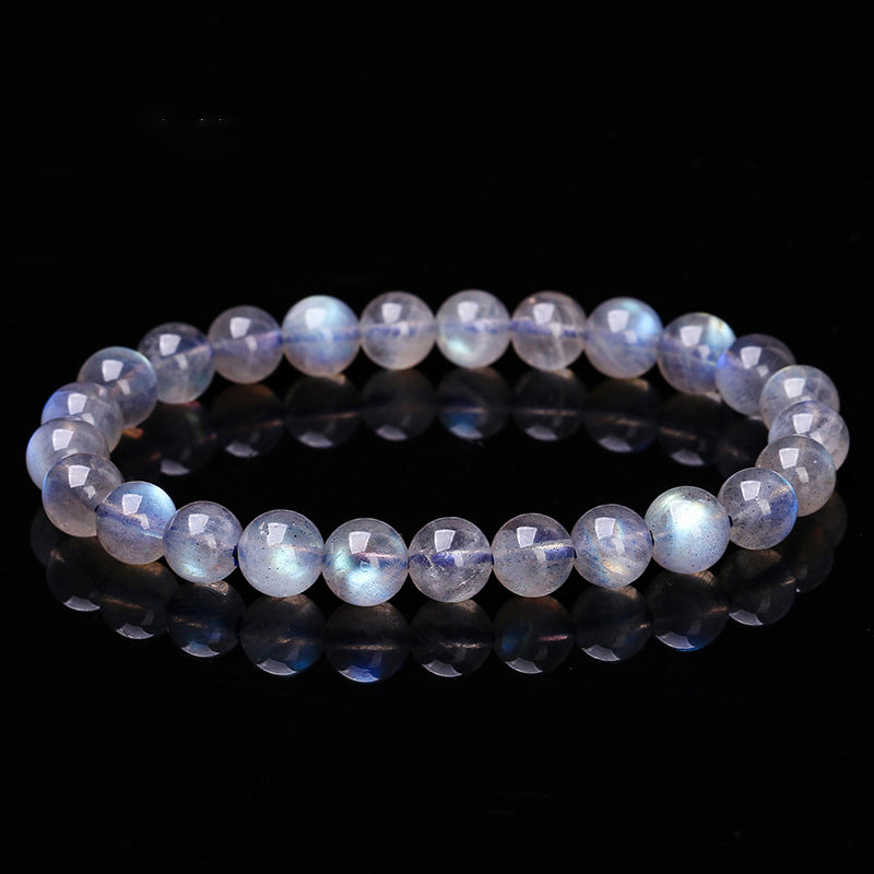 Beaded bracelet with a reflective surface on a black background