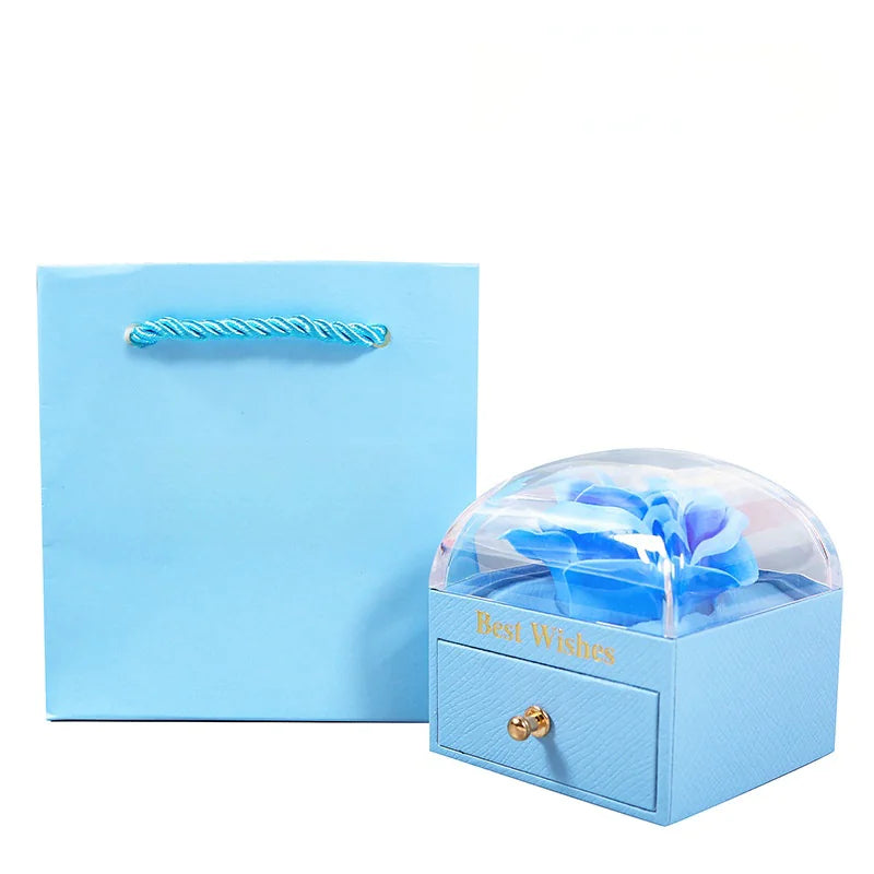 Blue jewelry box with a floral design and 'Best Wishes' text, accompanied by a matching blue card.