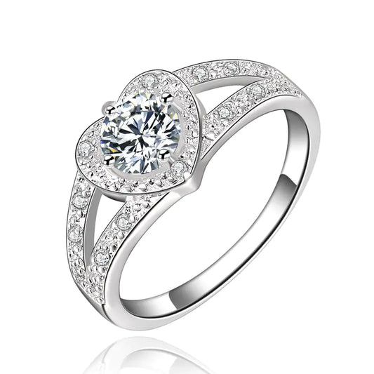 Silver ring with a large central gemstone and smaller stones on a white background