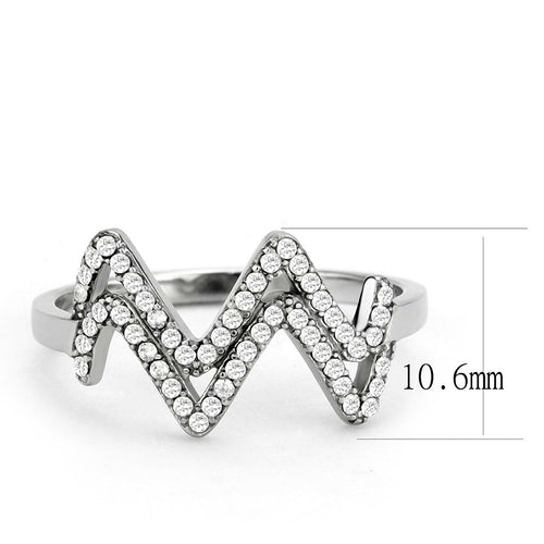 Silver ring with zigzag design and embedded crystals on a white background