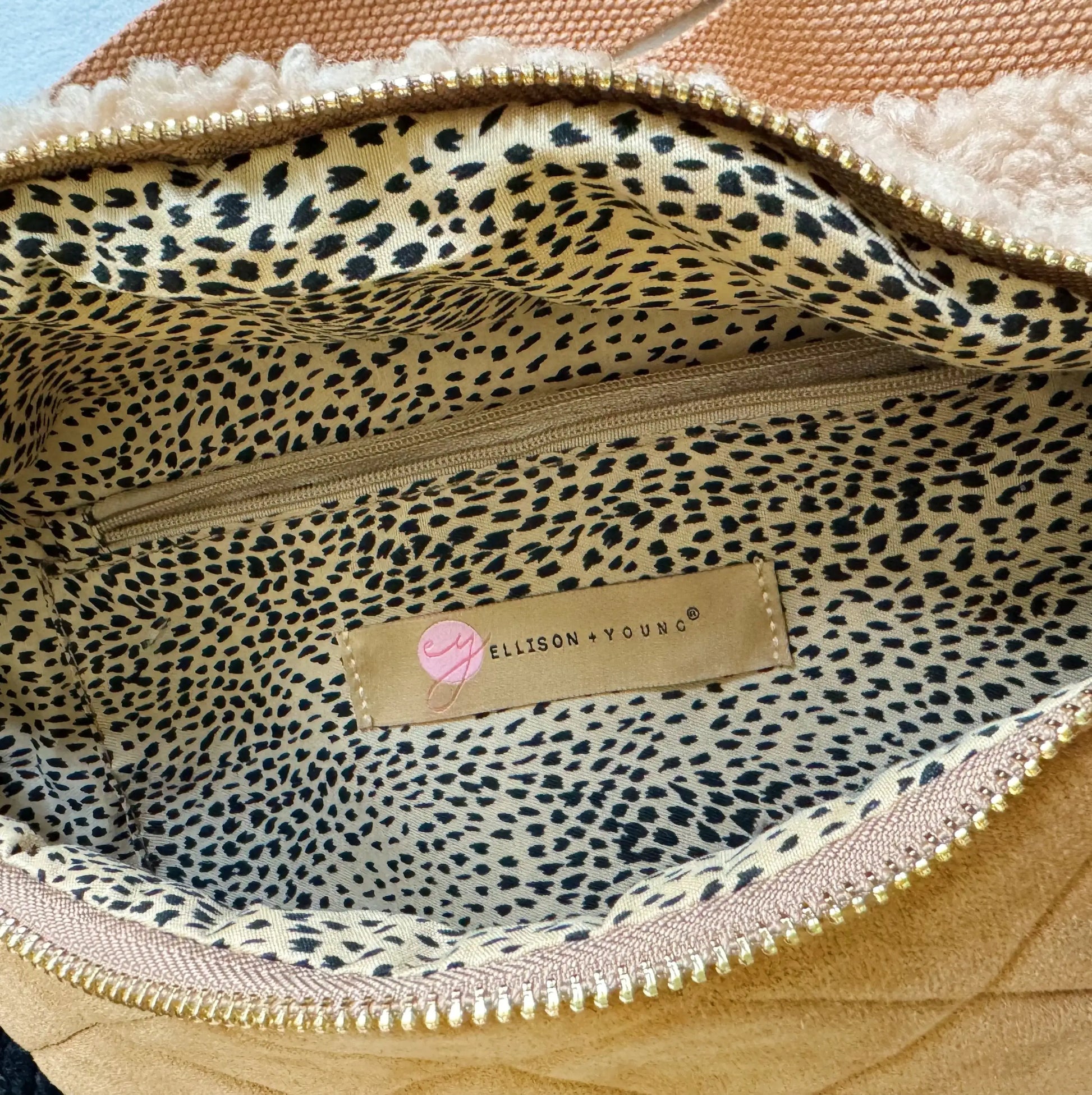 Leopard print interior of a bag with 'Ellison Young' label