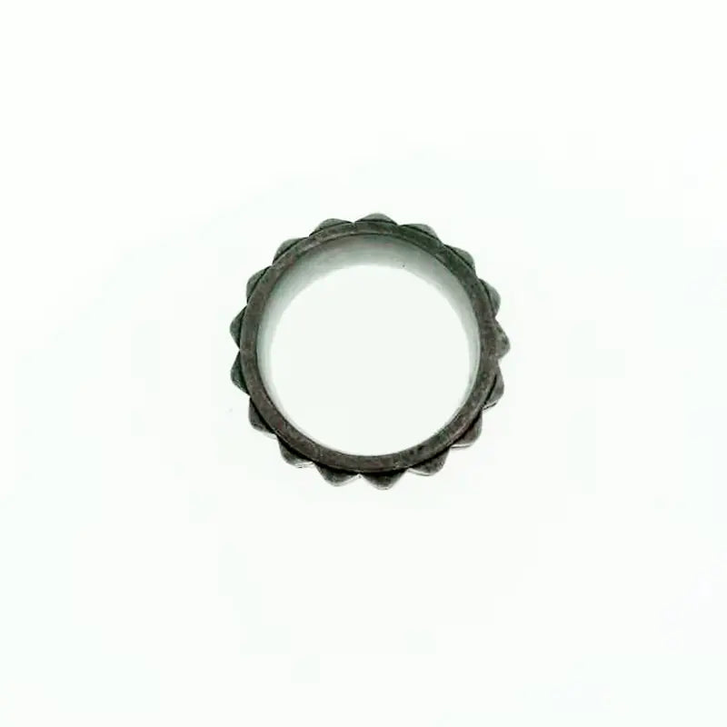 Metallic ring with a textured edge on a white background