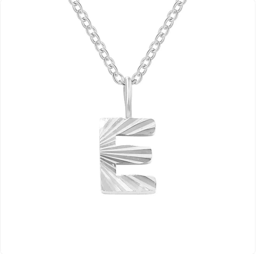 Silver necklace with a unique pendant on a white background