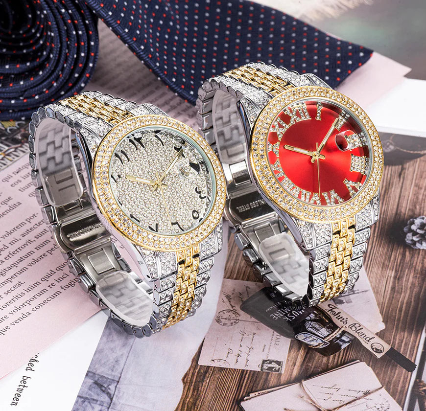 Two ornate watches with gold and silver straps on a wooden surface.