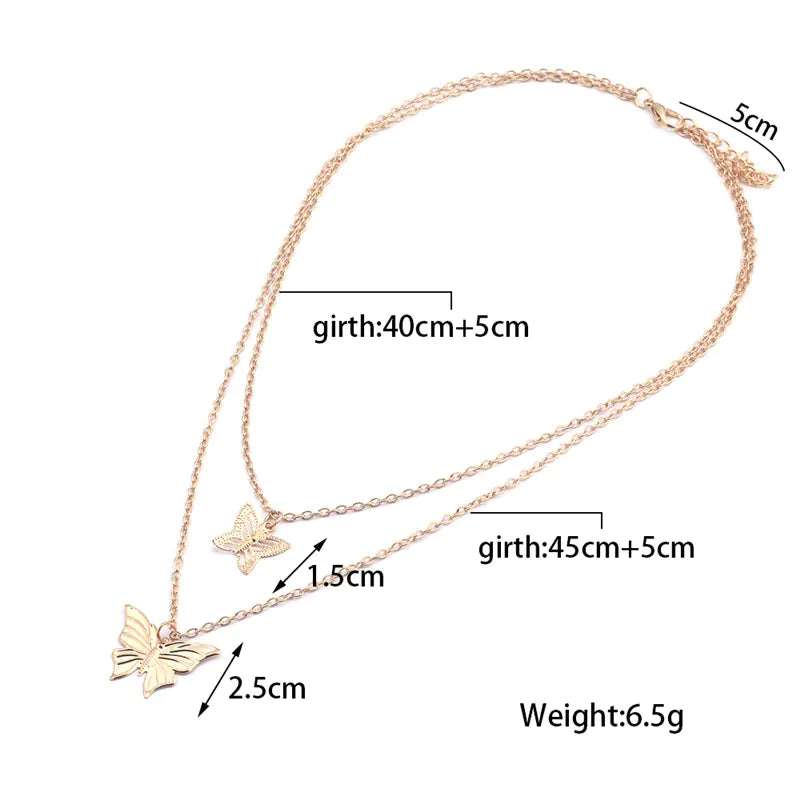 Rose gold necklace with butterfly pendants and measurements on a white background