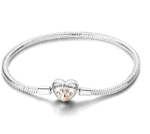 Silver bracelet with a heart-shaped charm on a white background