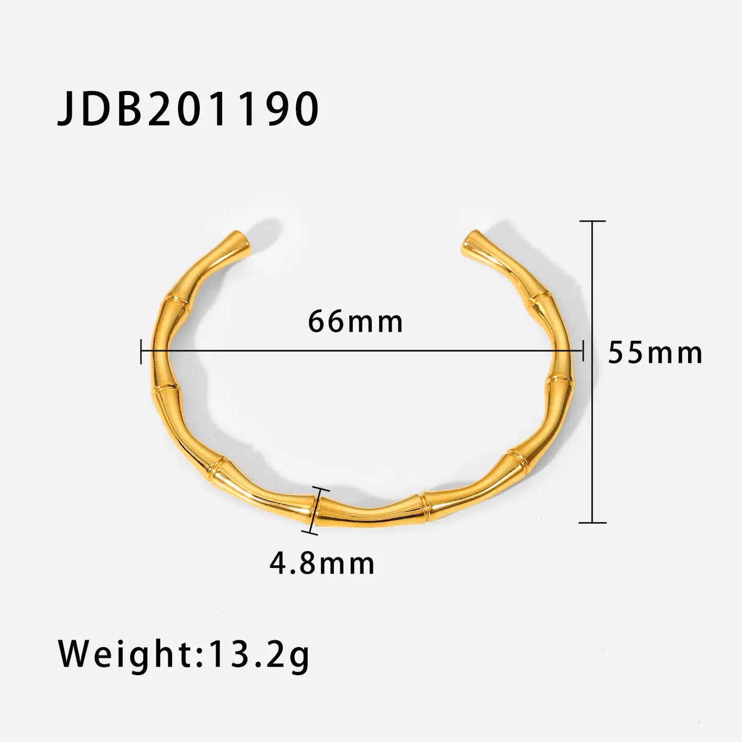 Gold bracelet with measurements on a white background