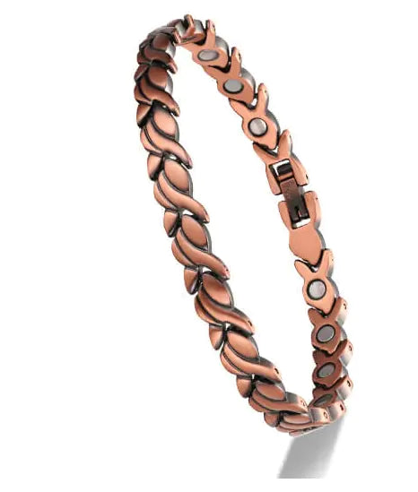 Copper bracelet with magnetic elements on a white background