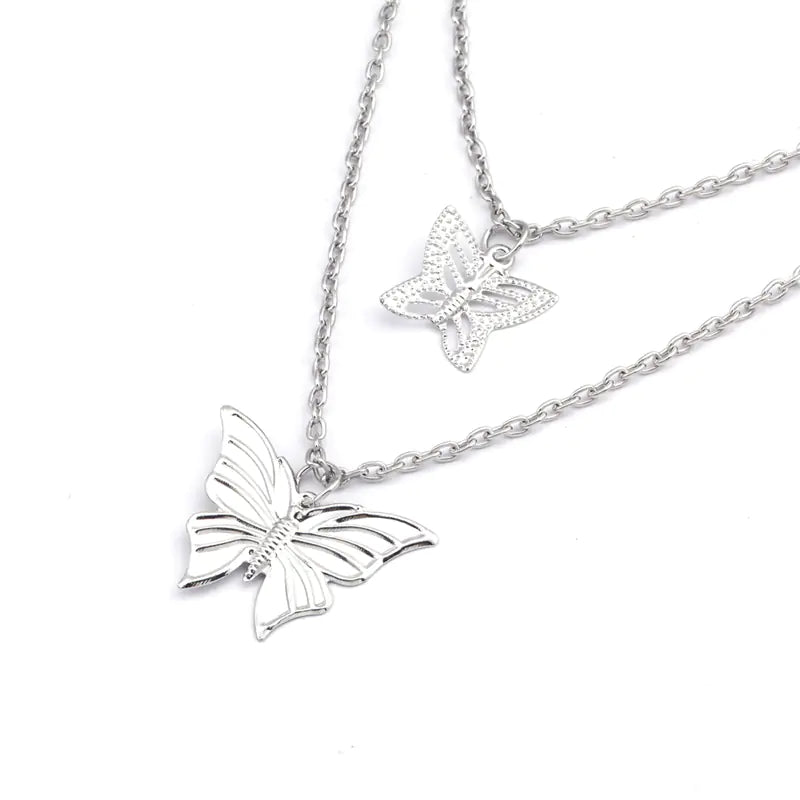 Silver butterfly necklace on a white background