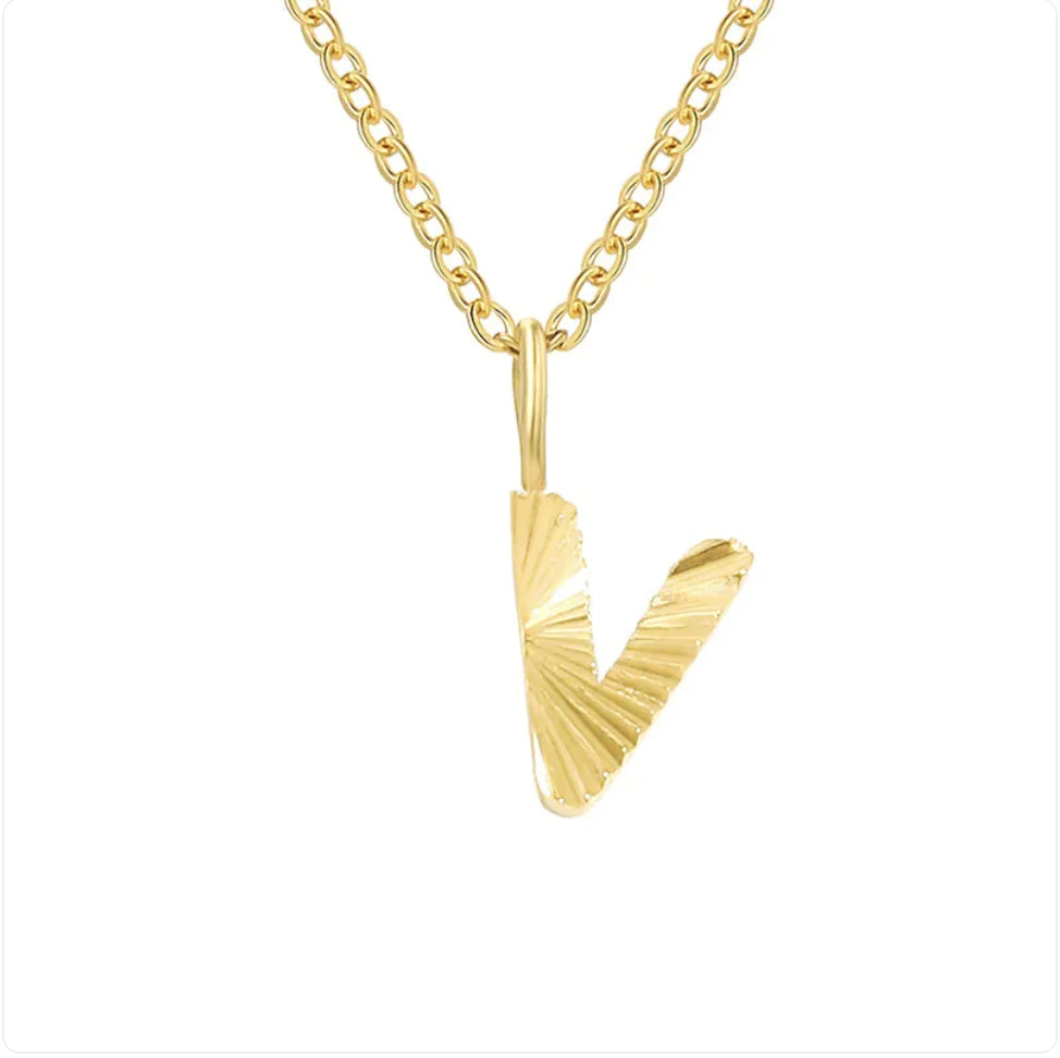 Gold necklace with a 'V' pendant on a white background