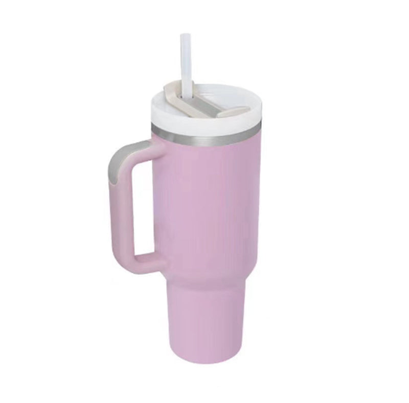 Pink mug with handle and white lid on a white background