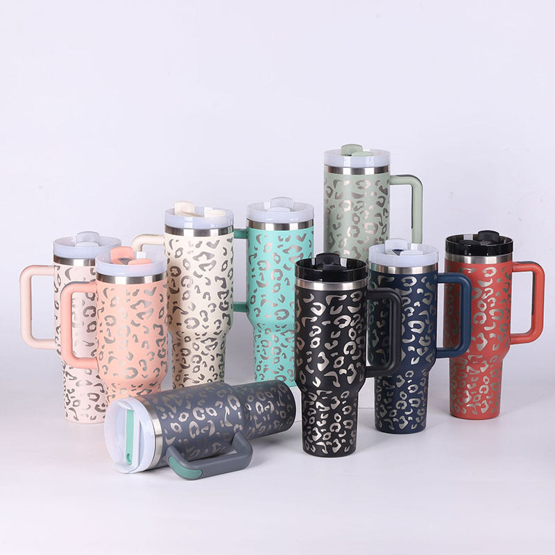 Collection of patterned travel mugs on a white background